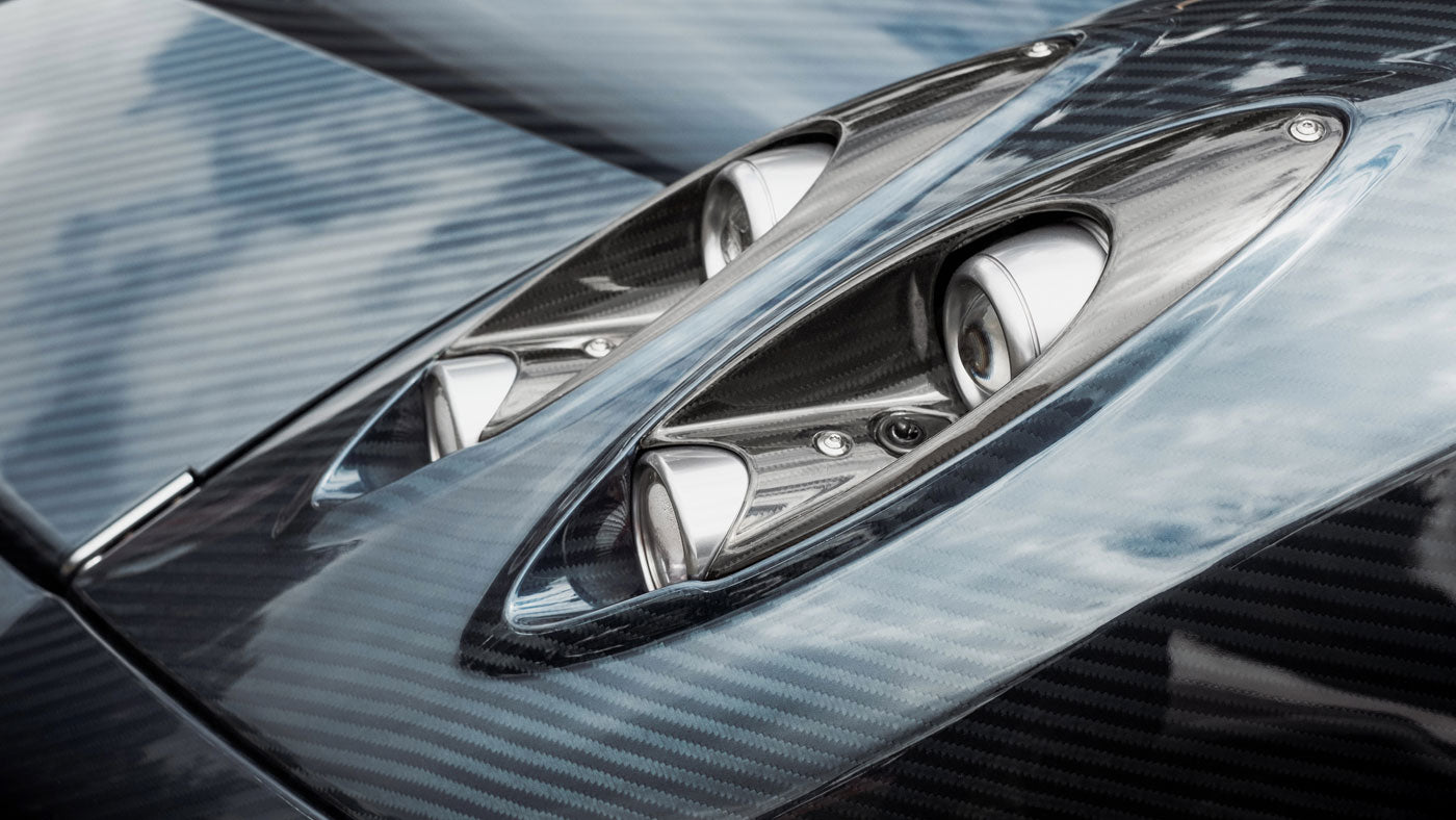 White coupe parked near house